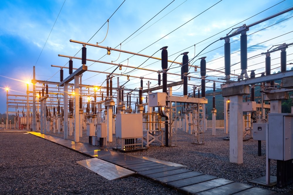 electric,substation,illuminated,at,dusk